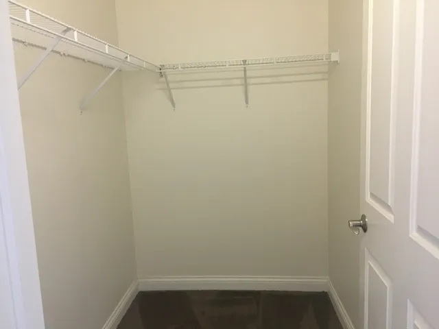a view of an empty walk in closet