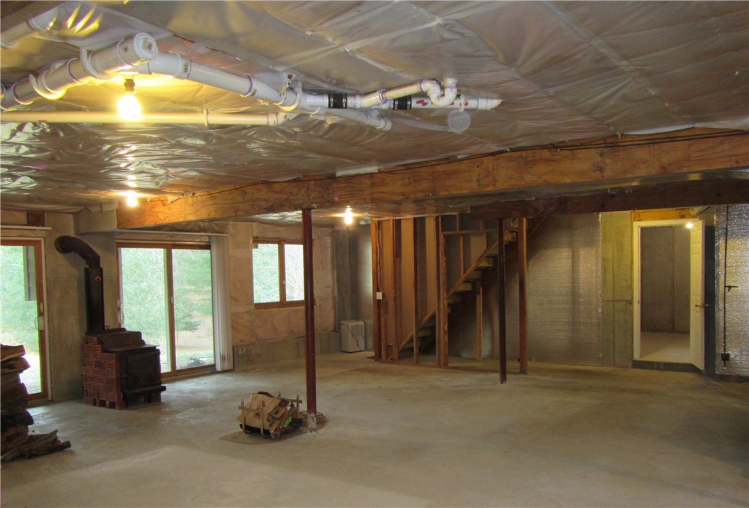 3 Almarose Drive West Kingston, RI 02892 - Photo 31 of 40 WALKOUT BASEMENT WITH WOOD STOVE