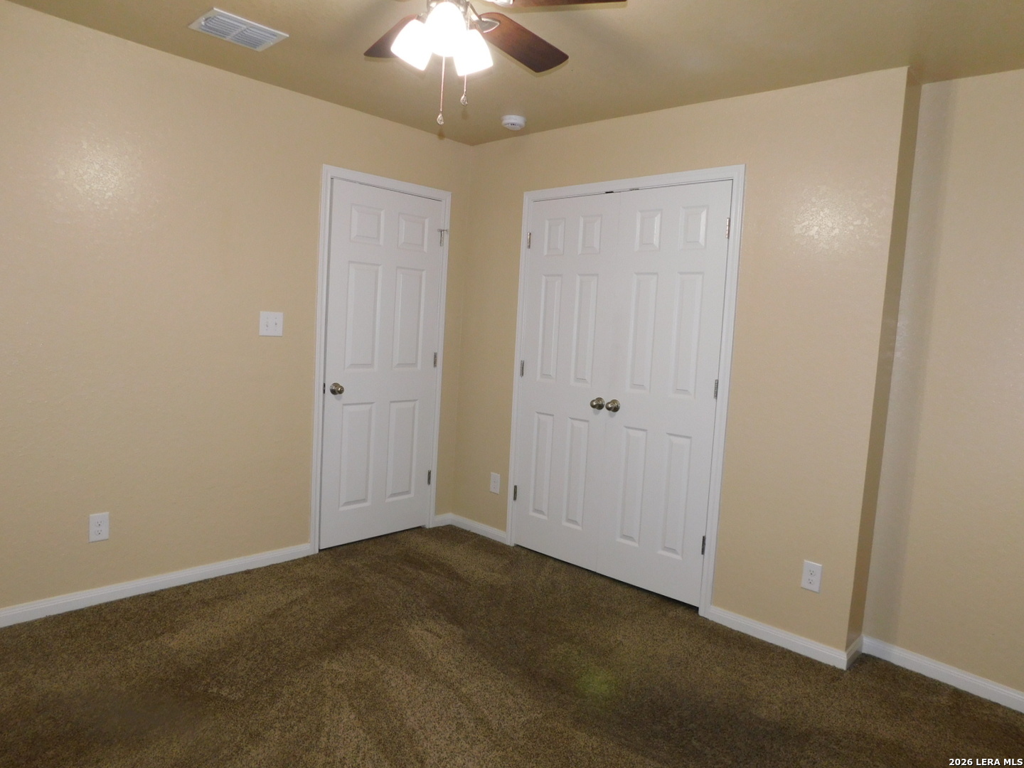 8710 8th Street, Unit 2 Converse, TX 78109 - Photo 12 of 18 an empty room with a chandelier fan