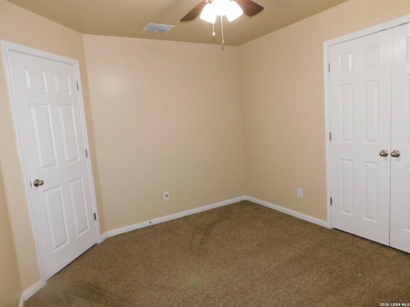 8710 8th Street, Unit 2 Converse, TX 78109 - Photo 16 of 18 an empty room with a chandelier fan