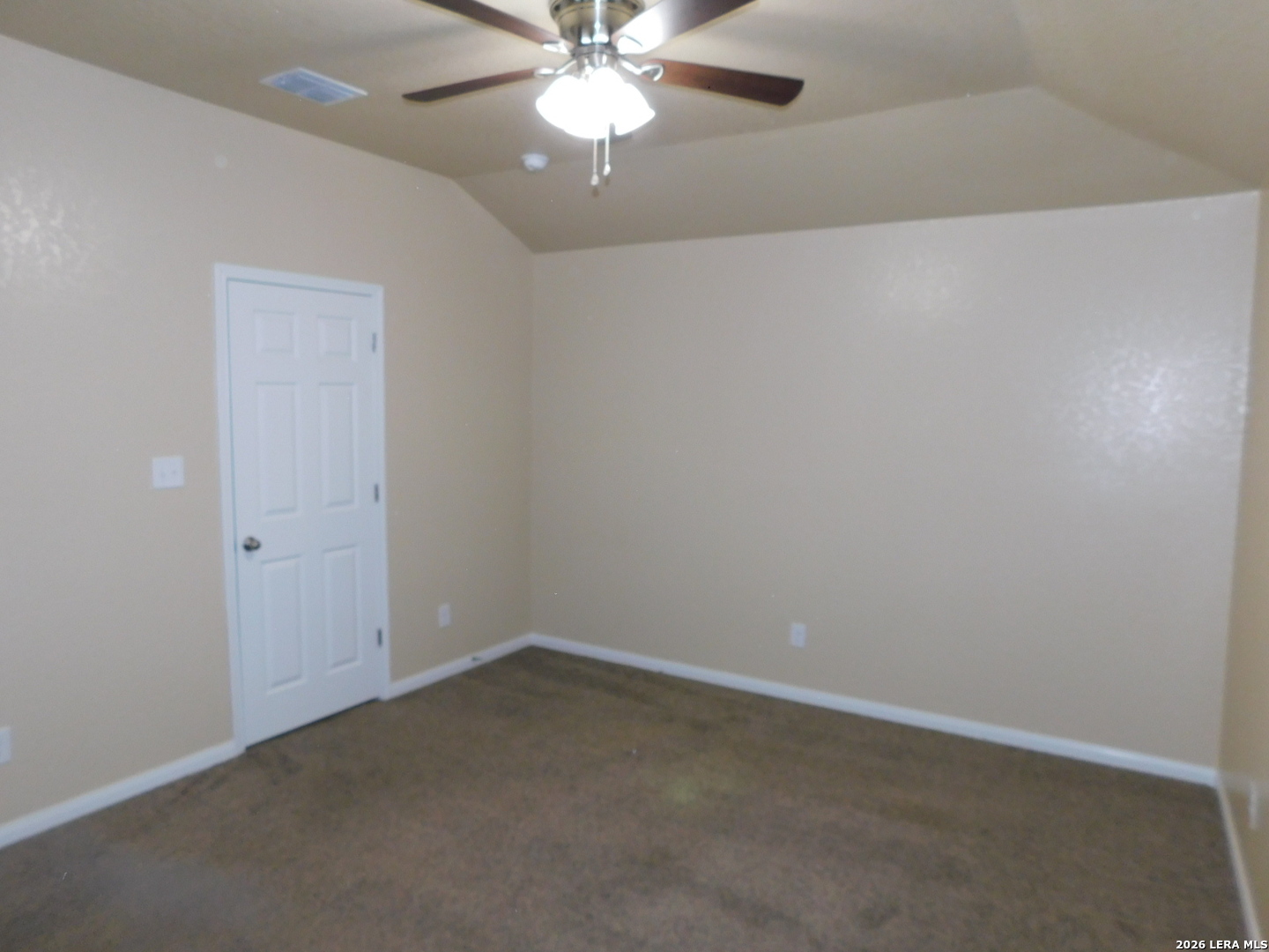 8710 8th Street, Unit 2 Converse, TX 78109 - Photo 8 of 18 an empty room with a fan & a window