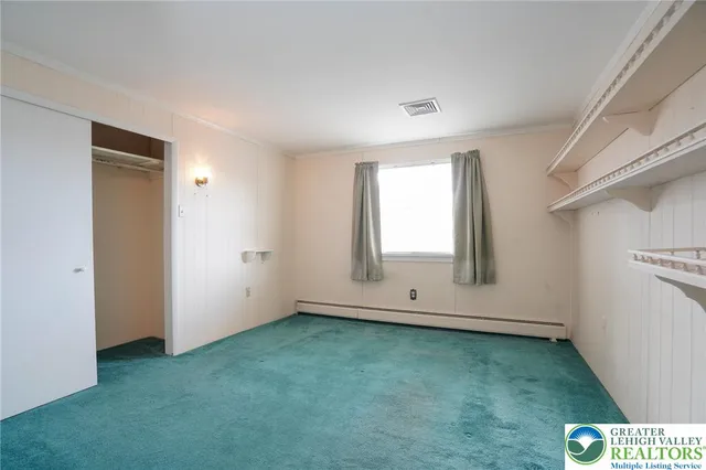 a view of a hallway with washer and dryer