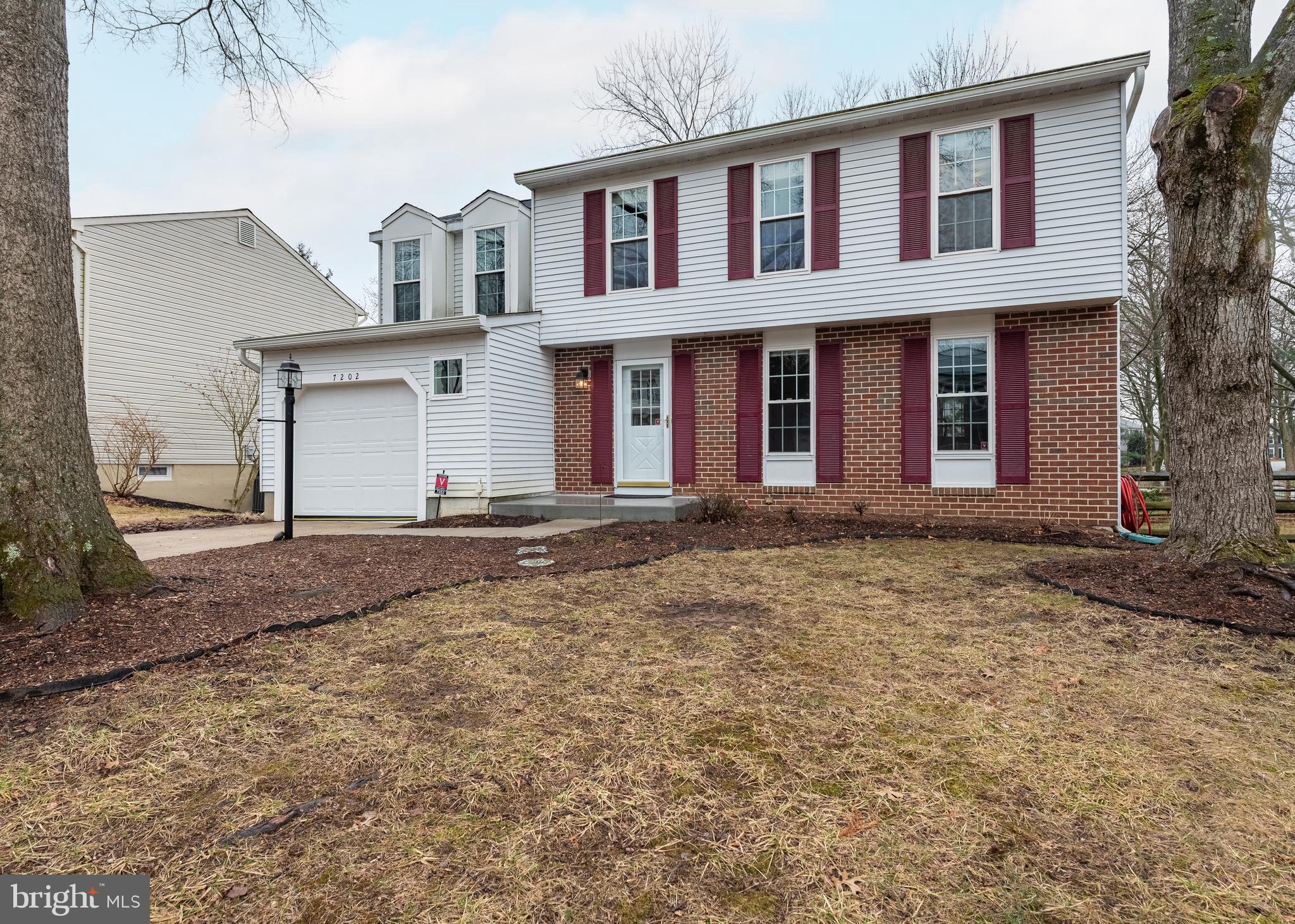 7202 Single Wheel Path Columbia, MD 21046 - Photo 2 of 30 front view of a house with a yard