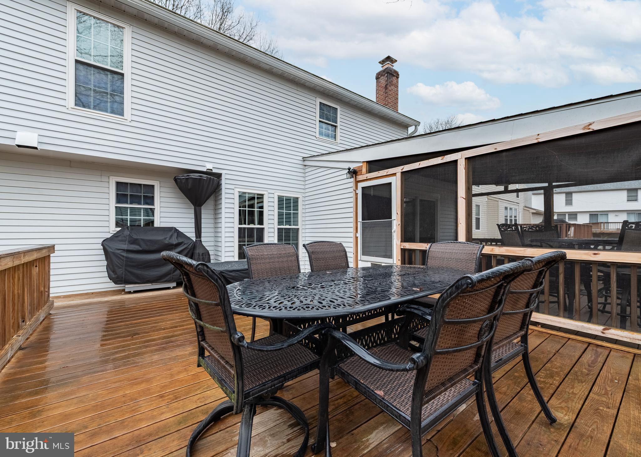 7202 Single Wheel Path Columbia, MD 21046 - Photo 27 of 30 a view of a patio with table and chairs