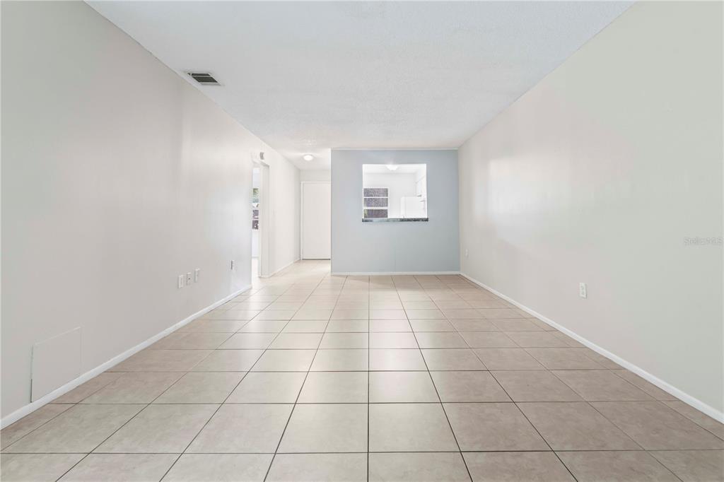 11511 113th Street, Unit 4F Largo, FL 33778 - Photo 11 of 30 a view of an empty room with a window