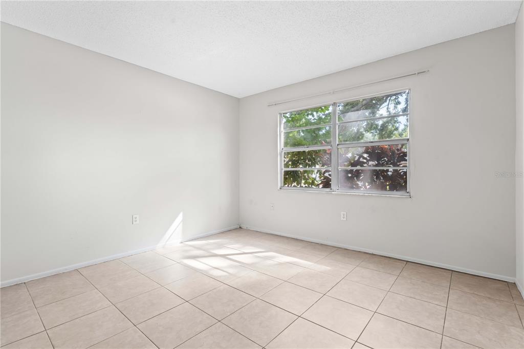 11511 113th Street, Unit 4F Largo, FL 33778 - Photo 14 of 30 an empty room with windows