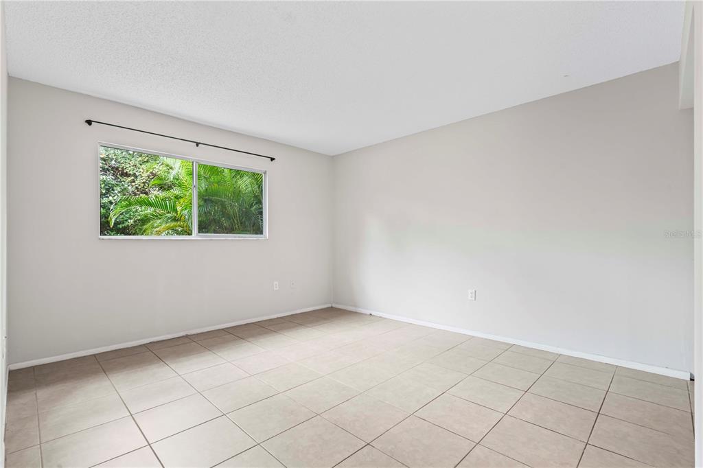 11511 113th Street, Unit 4F Largo, FL 33778 - Photo 20 of 30 an empty room with windows