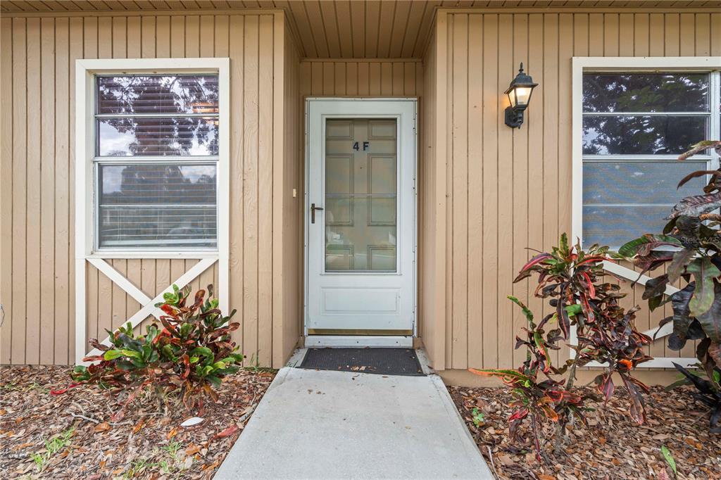 11511 113th Street, Unit 4F Largo, FL 33778 - Photo 2 of 30 a view of a entryway door of the house