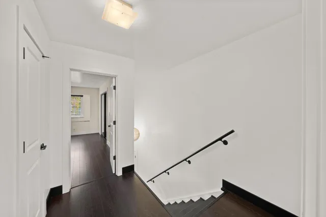 a bathroom with a sink a toilet a mirror and shower