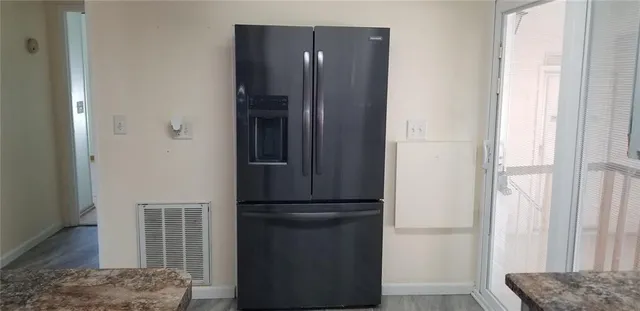 a view of bedroom with furniture and wooden floor