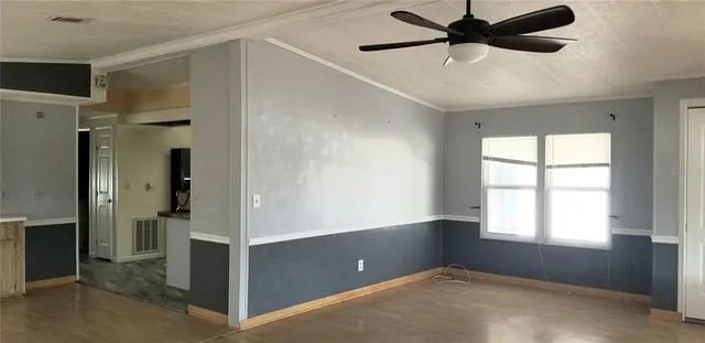 a view of an empty room with a window