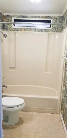 a bathroom with a shower curtain and a sink