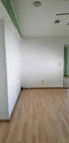 a bathroom with a granite countertop sink a toilet and a shower