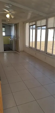 a view of an empty room with a fireplace