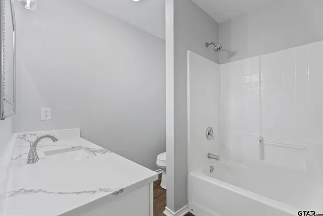 a bathroom with a sink and a bathtub