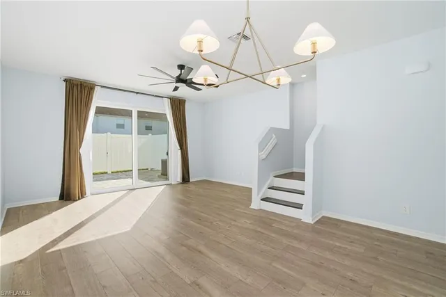a bathroom with a toilet and a shower curtain