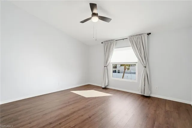 a bathroom with a toilet sink shower and mirror