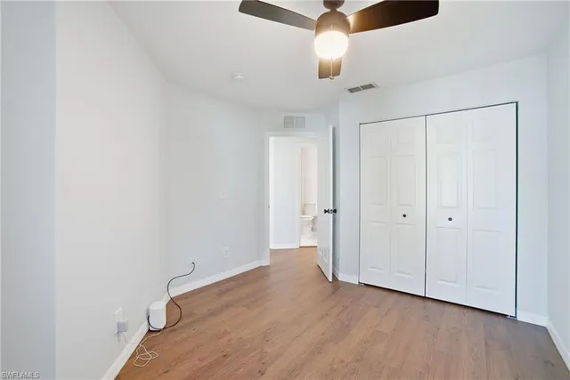 a view of a hallway with wooden walls and stairs