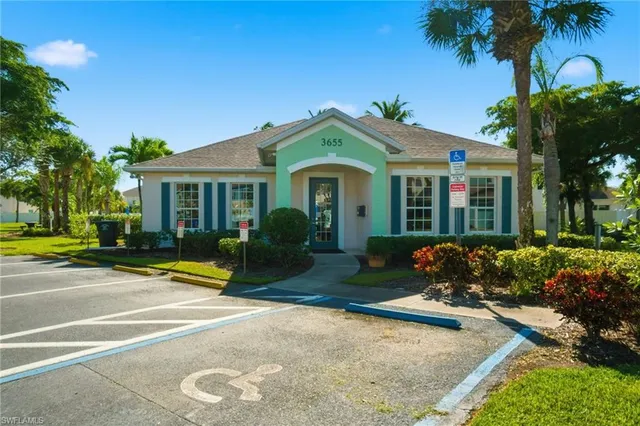 a view of a backyard with sitting area