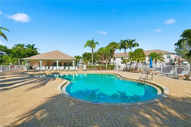 a living room with furniture a flat screen tv and a rug