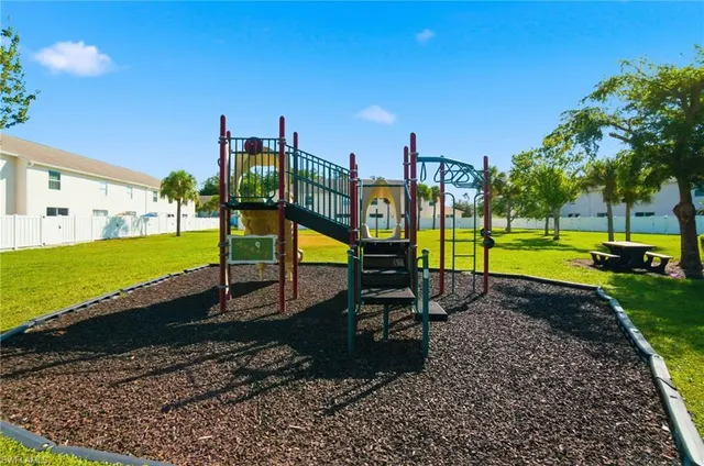 a room with gym equipment and a flat screen tv