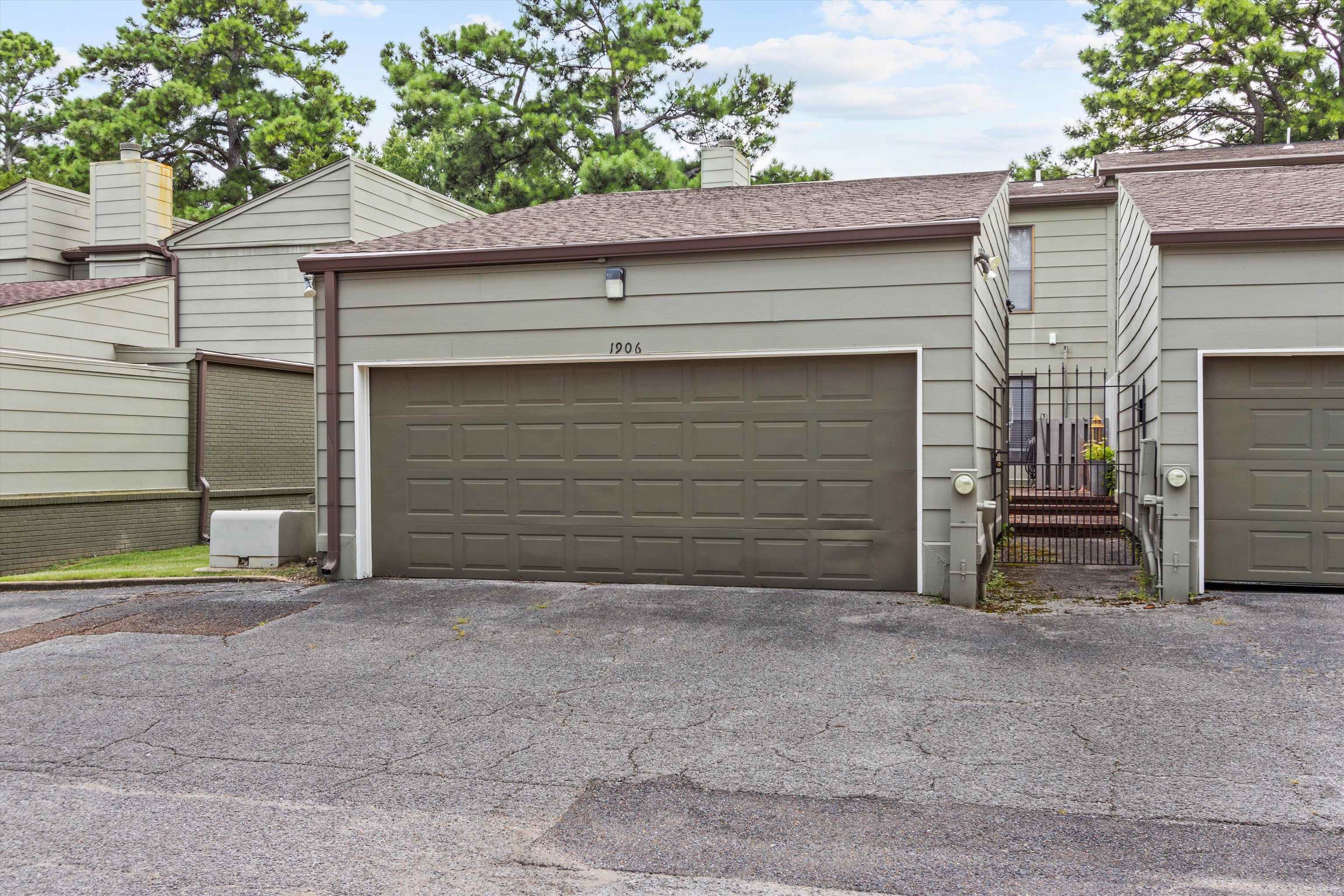 1906 Allenby Road, Unit 16 Germantown, TN 38139 - Photo 25 of 31 Multi-unit residence featuring two attached garages, a gated entry, and a pitched roof
