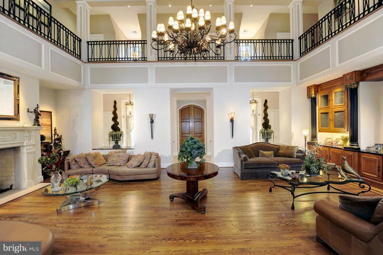 11218 River View Drive Potomac, MD 20854 - Photo 11 of 24 a living room with fireplace furniture and a large window