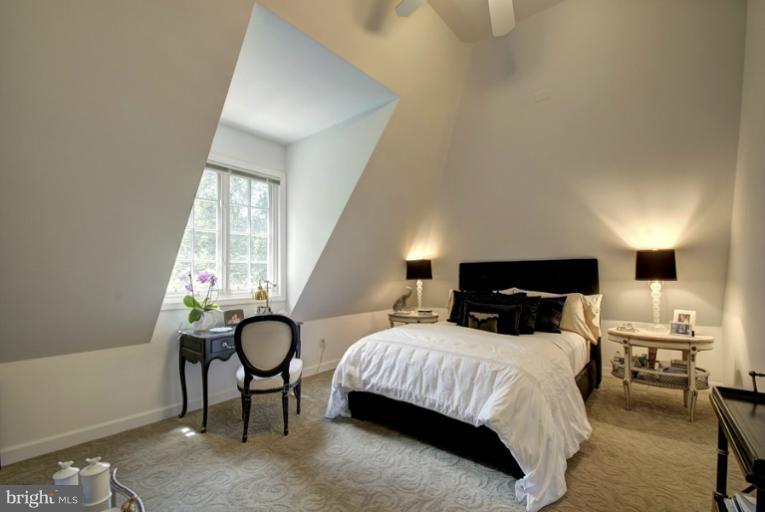 11218 River View Drive Potomac, MD 20854 - Photo 21 of 24 a bedroom with a bed and a window