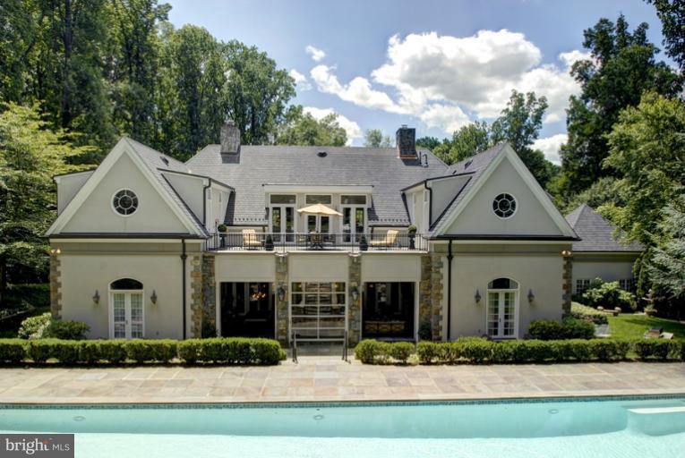 11218 River View Drive Potomac, MD 20854 - Photo 23 of 24 a front view of a house with garden