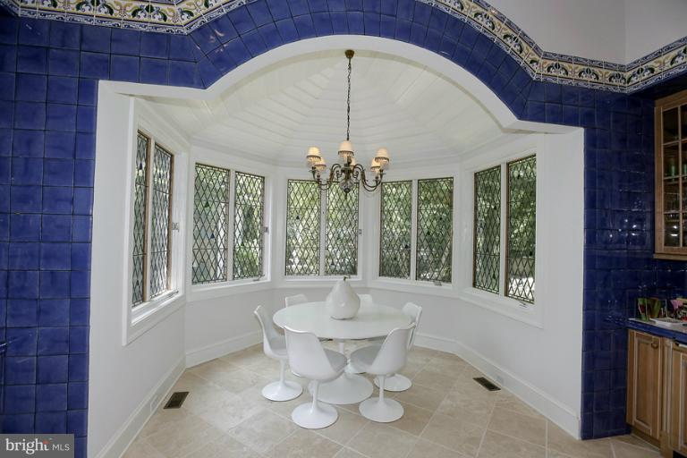 11218 River View Drive Potomac, MD 20854 - Photo 9 of 24 a view of a dining room with furniture and chandelier