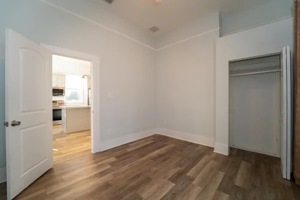 a view of a kitchen with wooden floor