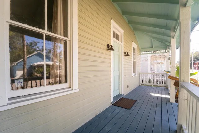 a view of a balcony with wooden floor