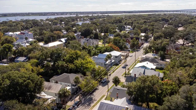 an aerial view of residential houses with outdoor space