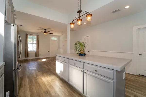 a view of cabinets and wooden floor