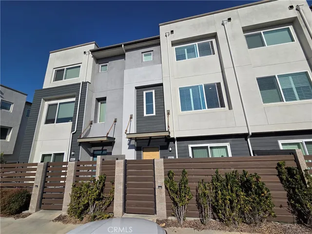 a front view of a building with many windows