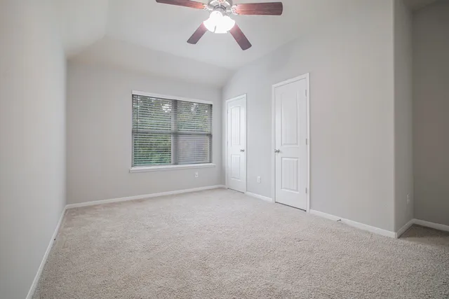 a view of an empty room with a window