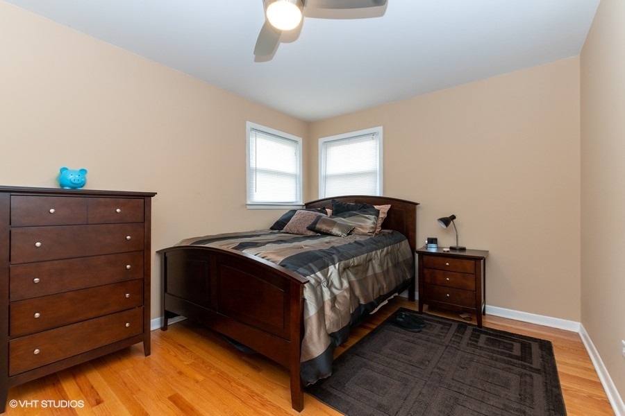 2605 West 83rd Place Chicago, IL 60652 - Photo 7 of 14 a bedroom with a bed and a dresser