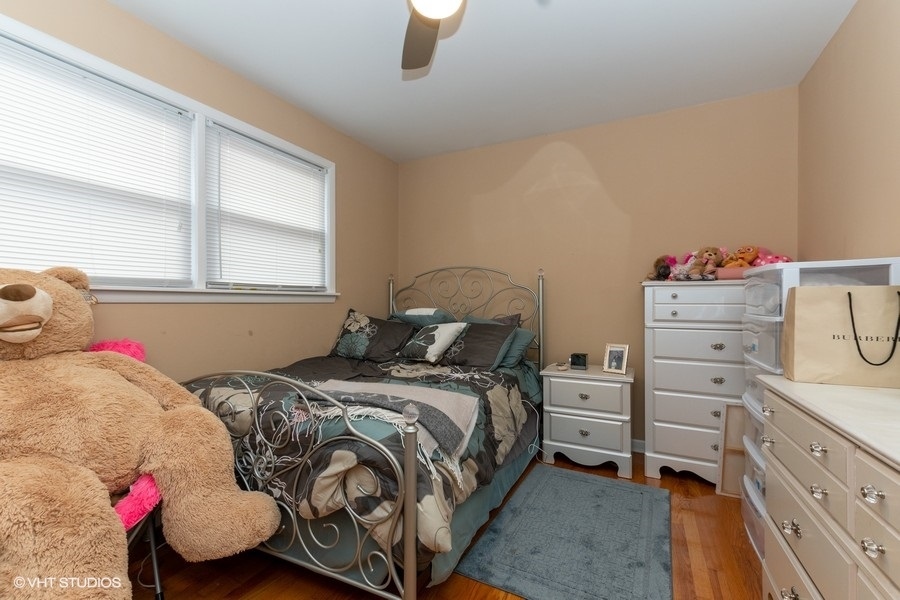 2605 West 83rd Place Chicago, IL 60652 - Photo 9 of 14 a bedroom with a bed and a window