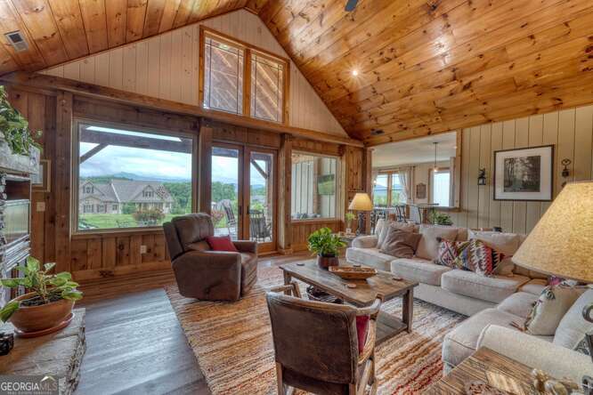 85 Minstead Ridge Young Harris, GA 30582 - Photo 11 of 50 a living room with furniture fireplace and a large window