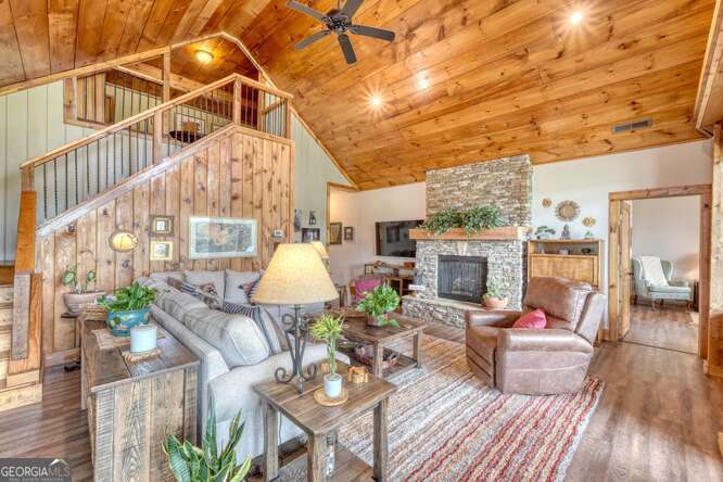 85 Minstead Ridge Young Harris, GA 30582 - Photo 27 of 50 a view of a patio with couches table and chairs and potted plants
