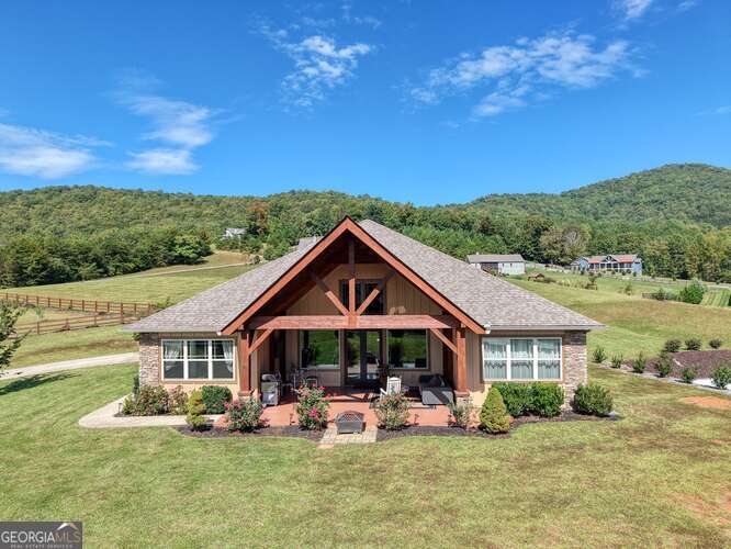 85 Minstead Ridge Young Harris, GA 30582 - Photo 33 of 50 a front view of house with yard outdoor seating and barbeque oven