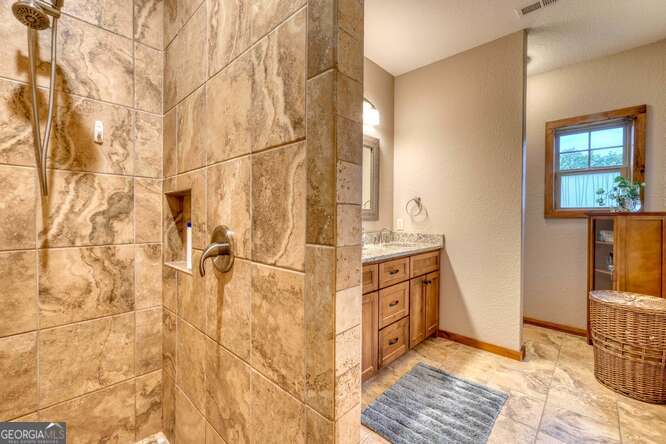 85 Minstead Ridge Young Harris, GA 30582 - Photo 38 of 50 a bathroom with a sink and a mirror