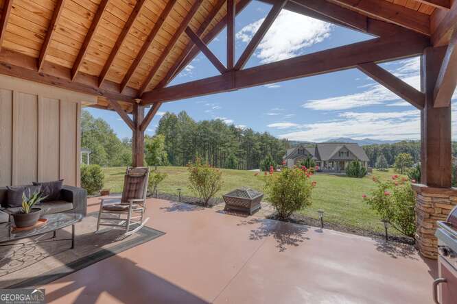 85 Minstead Ridge Young Harris, GA 30582 - Photo 40 of 50 a view of a porch with furniture and a yard