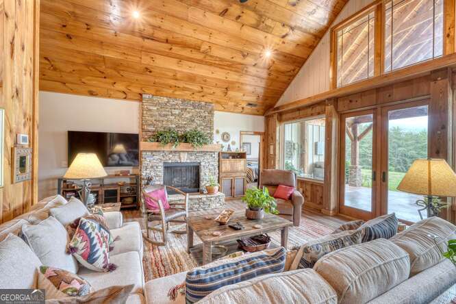85 Minstead Ridge Young Harris, GA 30582 - Photo 43 of 50 a living room with fireplace furniture and a large window