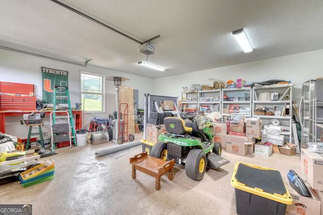 85 Minstead Ridge Young Harris, GA 30582 - Photo 47 of 50 a living room with furniture gym equipment and a large window