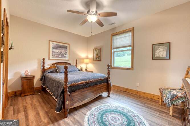 85 Minstead Ridge Young Harris, GA 30582 - Photo 5 of 50 a bedroom with a bed and window