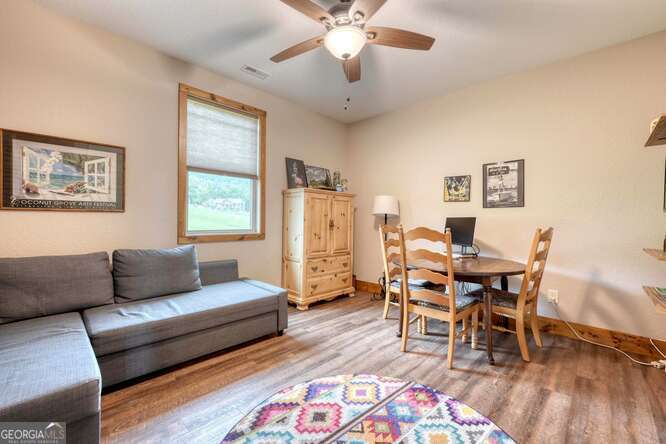 85 Minstead Ridge Young Harris, GA 30582 - Photo 10 of 50 a living room with furniture and a wooden floor