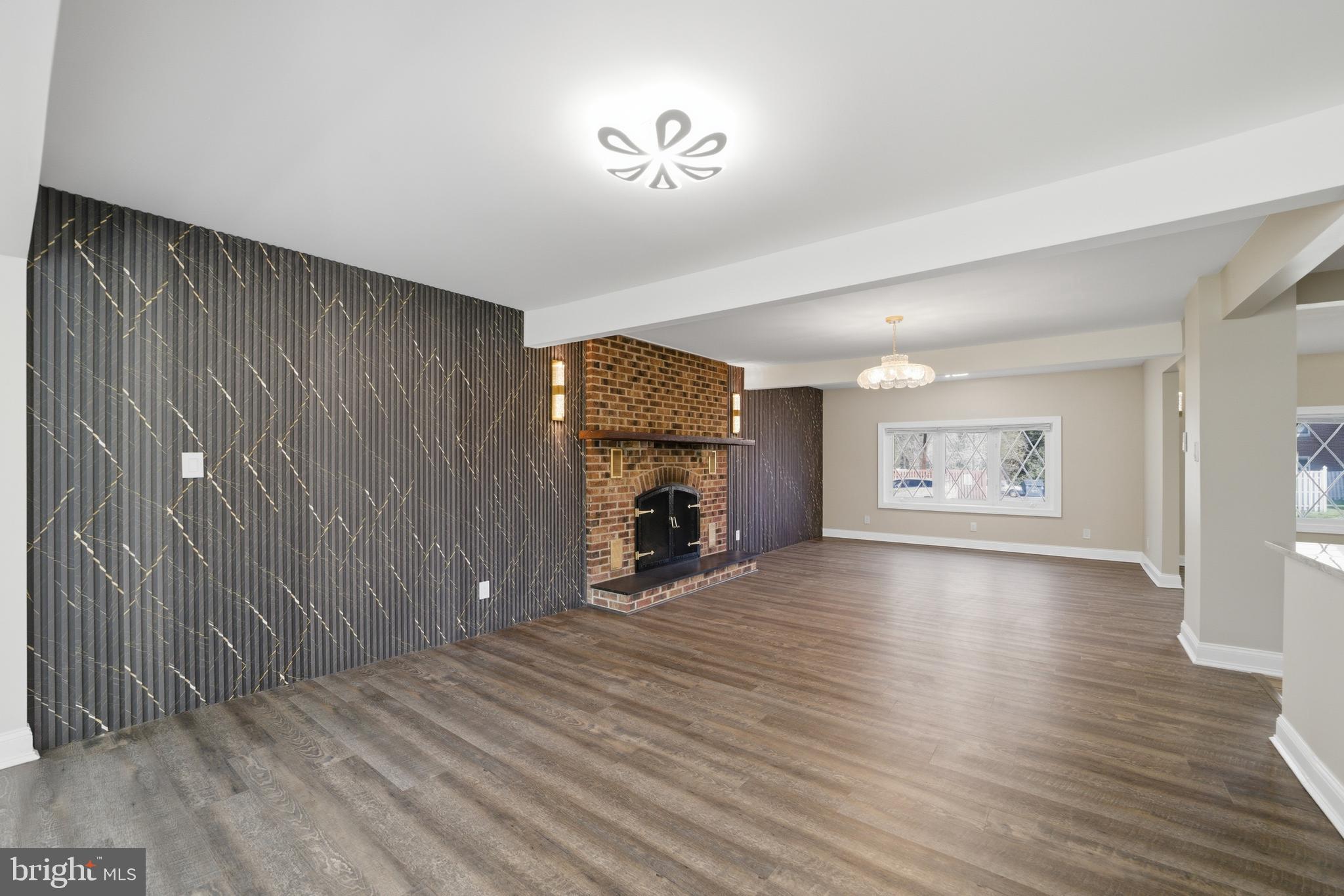 443 High Street Woodbury, NJ 08096 - Photo 13 of 28 an empty room with windows and a fireplace