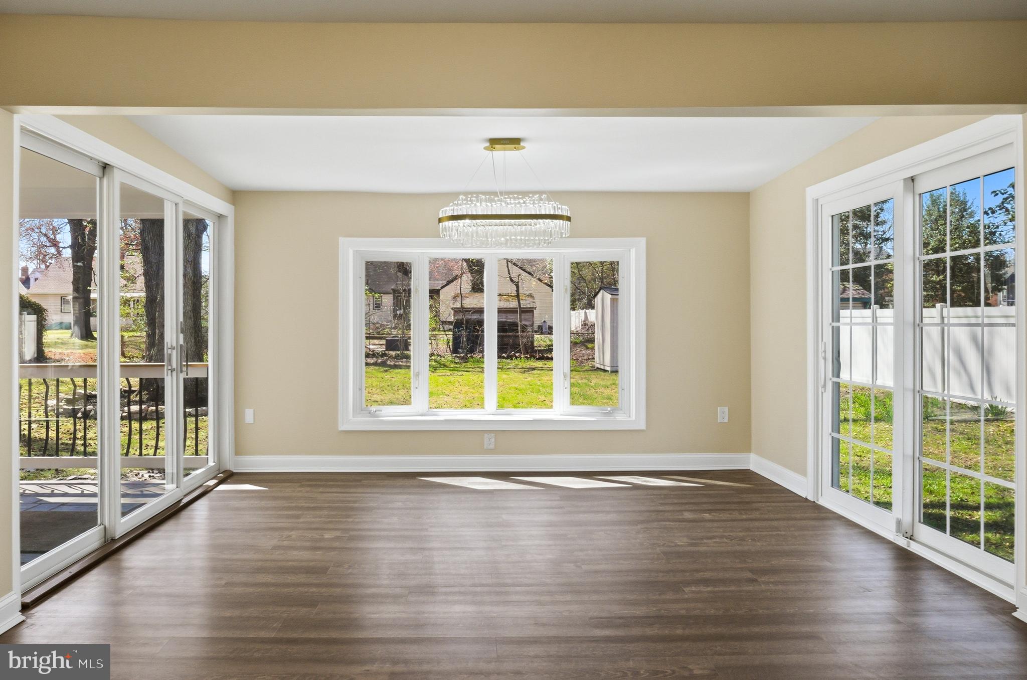 443 High Street Woodbury, NJ 08096 - Photo 15 of 28 a view of an empty room with wooden floor and a window