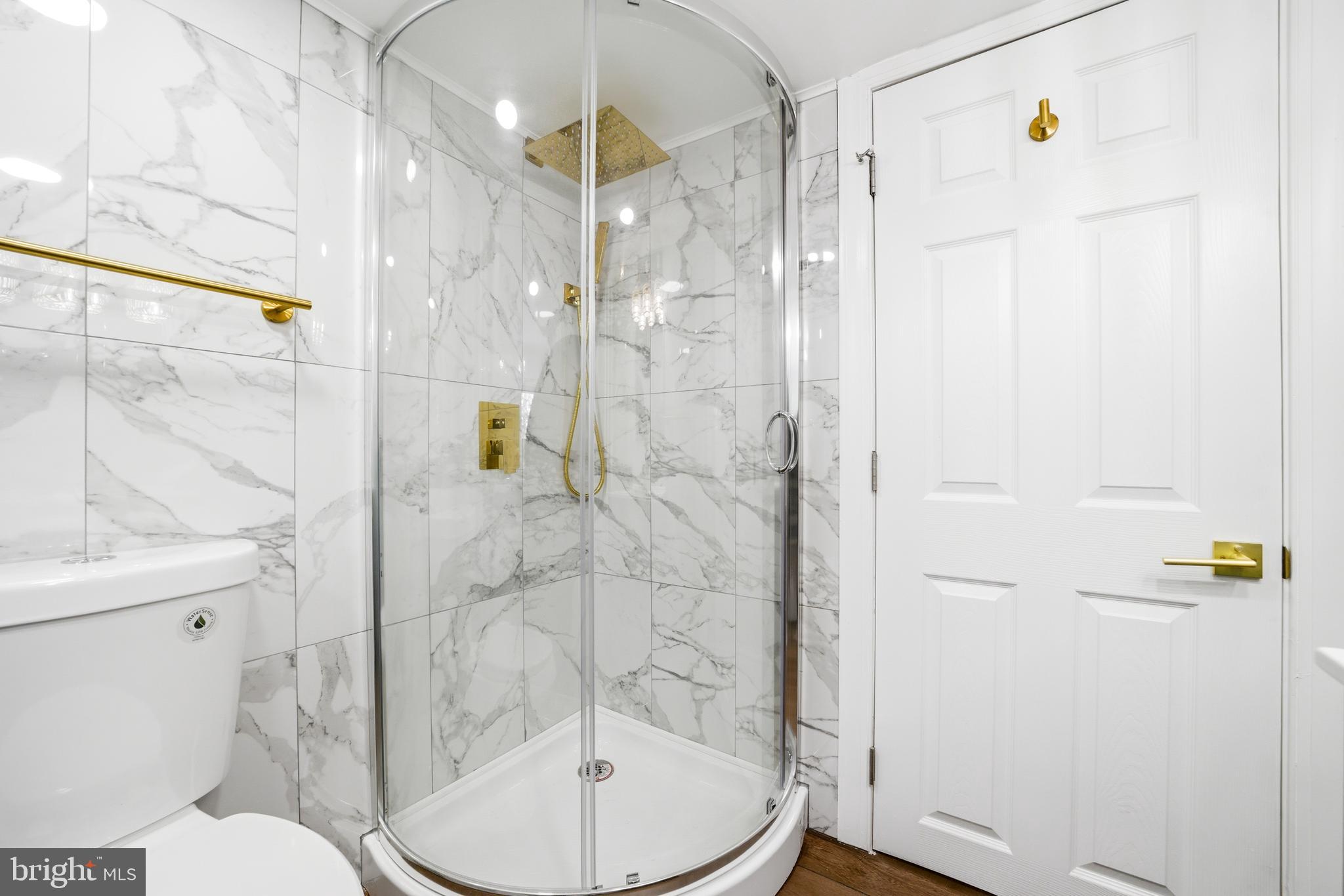 443 High Street Woodbury, NJ 08096 - Photo 22 of 28 a bathroom with a shower a toilet and a sink